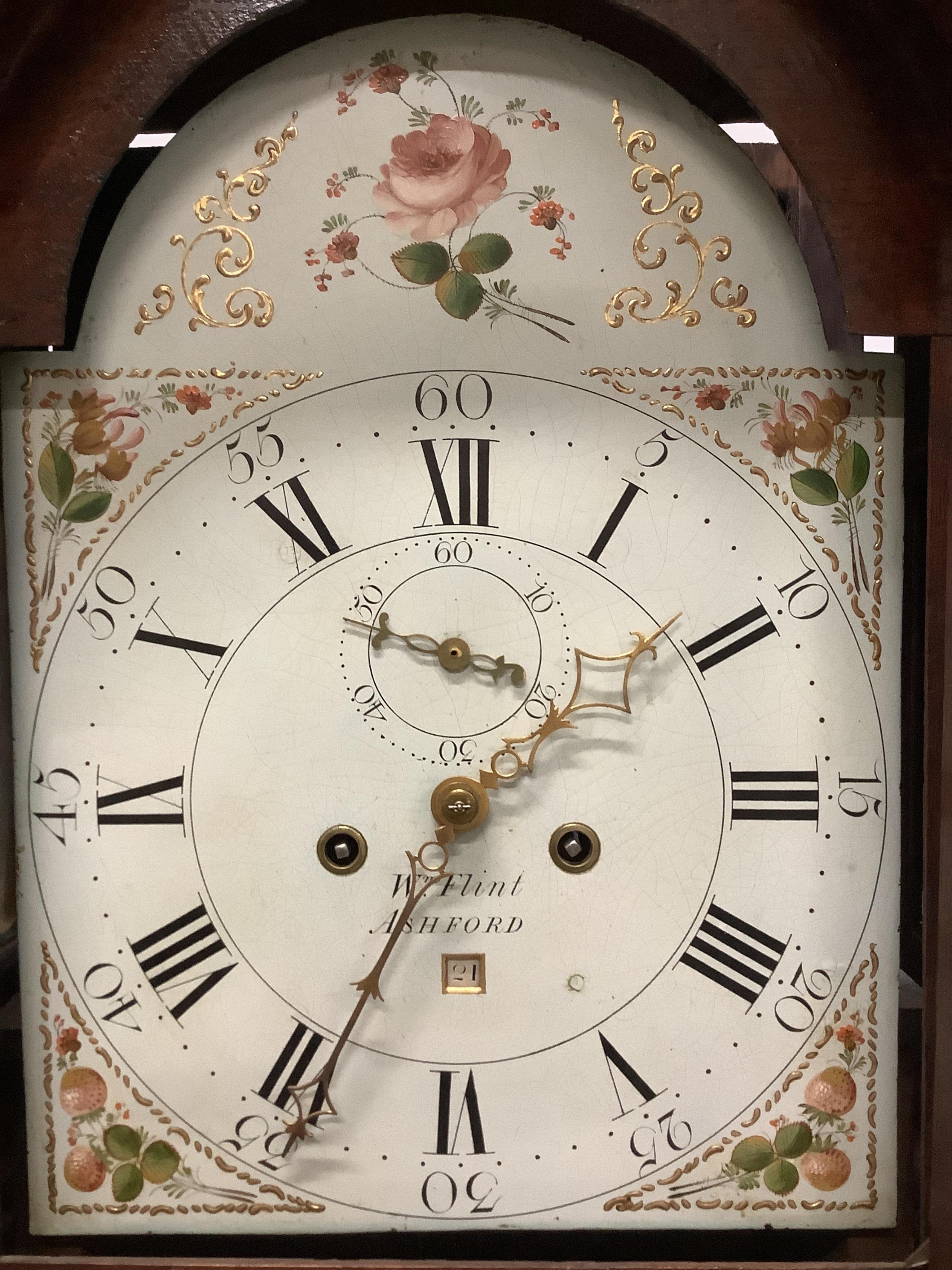 An early 19th century oak eight day longcase clock, painted dial marked Flint, Ashford, height 202cm. Condition - fair, glazed door cracked
